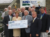 Senator Dole presents a USDA Rural Development for the construction of a new Town Hall.