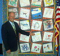 Congressman Radanovich admires the quilt made by Linda Smittcamp of Clovis. The quilt helped raise money for Children's Hospital Central California and is now on display in the Congressman's DC office