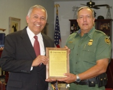 Congressman Bonilla Presents Chief Garza with the Congressional Record in his Honor