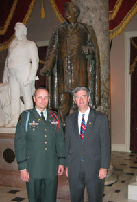 Photo - Rep. Miller invites Lt. Benjamin Wynn of Raleigh, an Iraq War vet from North Carolina's Army National Guard, to attend the speech of Iraqi Prime Minister Dr. Nouri al-Maliki to a Joint Meeting of Congress. The two are standing in the Capitol's National Statuary Hall near the bronze statue of Senator Zebulon Vance, who was a former NC governor and US representative.