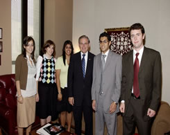 Senator Menendez visits with interns.style=