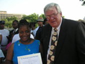 photo, education section, speaker hastert with a member of the community
