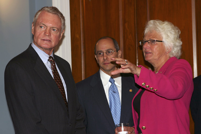 Picture: Reps. Tom Osborne and Charles Boustany speak with European Union Agriculture Commissioner Mariann Fischer-Boel following her meeting with Members of the Committee, September 13, 2005.