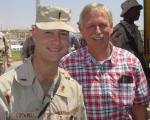 Rep. Snyder visits with a member of his staff deployed in Iraq (08/2004)