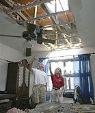 U.S. Representative Debbie Wasserman Schultz is joined by a Sunrise Lakes resident as she inspects damage to condominiums in Sunrise.