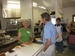 After speaking with constituents at his state fair booth, Senator Coleman chats with restaurant workers while ordering some homemade food at the Minnesota State Fair.  