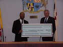 Hoyer presents Prince Georges County States Attorney Glenn Ivey with $260,000 to fight violent crime. 
