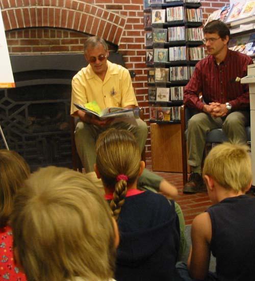 Earl reading to schoolchildren