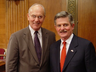 Chairman Larry Craig standing with VA Secretary Jim Nicholson