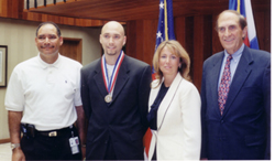 Congressman Hefley awarding Colorado Springs teen Michael Combs with the Silver Congressional Award Medal on August 27, 2003.