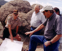 Congressman Hefley reviewing Browns Canyon Wilderness Study Area plans on August 29, 2003 with Colorado State Park Manager Robert White and congressional aide Loren Whittemore.