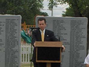 Dan standing in front of the Veterans Memorial in Roland