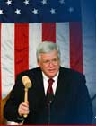 photo of Rep. Hastert with gavel in fron of American flag