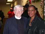 Rev. Dr. Steven Archer joining Congresswomen Kilpatrick at the 13th Congressional District 2005 Christmas Party.