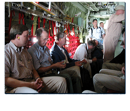 Congressman Rogers (far left) flies to Baghdad aboard an Army C-130. Eight other members of Congress flew with Rogers on the bi-partisan delegation.