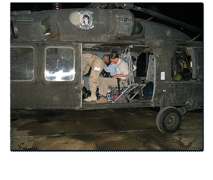 Congressman Rogers boards an Army helicopter for transport to the southern Iraqi city of Mosul.