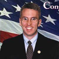 Portrait of Congressman Todd Russell Platts with an American flag in the background