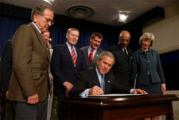 Congressman Rehberg joins President George Bush in the recent signing of the Indian Education Executive Order, which is designed to enhance Native American components of the No Child Left Behind Act.  From left to right are Alaska Senator Ted Stevens, Wyoming Senator Craig Thomas, Congressman Rehberg, Education Secretary Rod Paige, and Interior Secretary Gale Norton.	