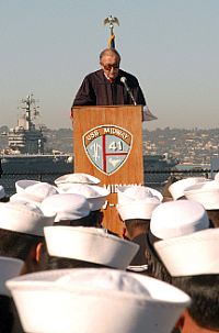  U.S. District Court Judge, Honorable John S. Rhoades delivers a speech before giving the oath of citizenship to U.S. service members aboard the USS Midway aircraft carrier museum. 