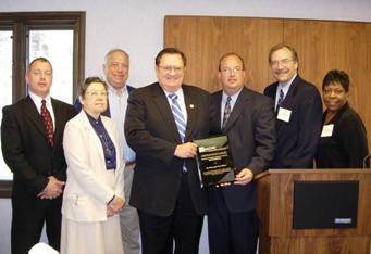 Congressman Paul Gillmor is pictured receiving the 2006 Distinguished Community Health Superhero Award in Fremont, Ohio.