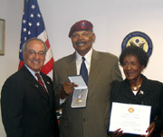 Congressman Baca presents a Silver Star to William Lawrence Jr., shown here with his wife, Elizabeth Lawrence.