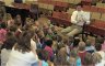 Paul reads a book to students at St. Mary's school in Janesville, WI, during national "turn-off TV" week.