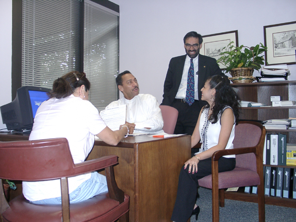 Congressman Watt learns the loan application process at the Latino Credit