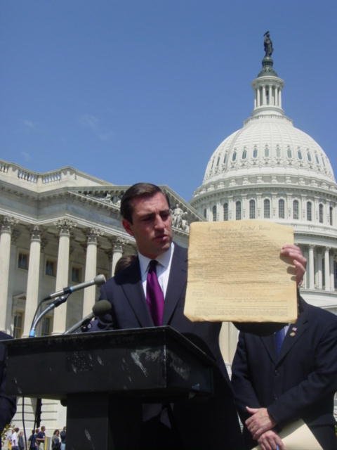 Vito holds up a copy of the Bill of Rights to emphasize the gravity of the process and the appropriateness of including the Crime Victims Rights Amendment with the others.