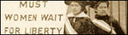 Two suffragists holding a picket sign.