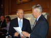 The photo is of Gov. Doyle and Rep. Petri discussing the Compact at the press conference.