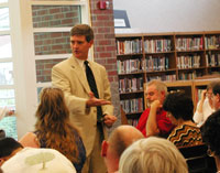 Photo - Miller speaks at a local town hall meeting.