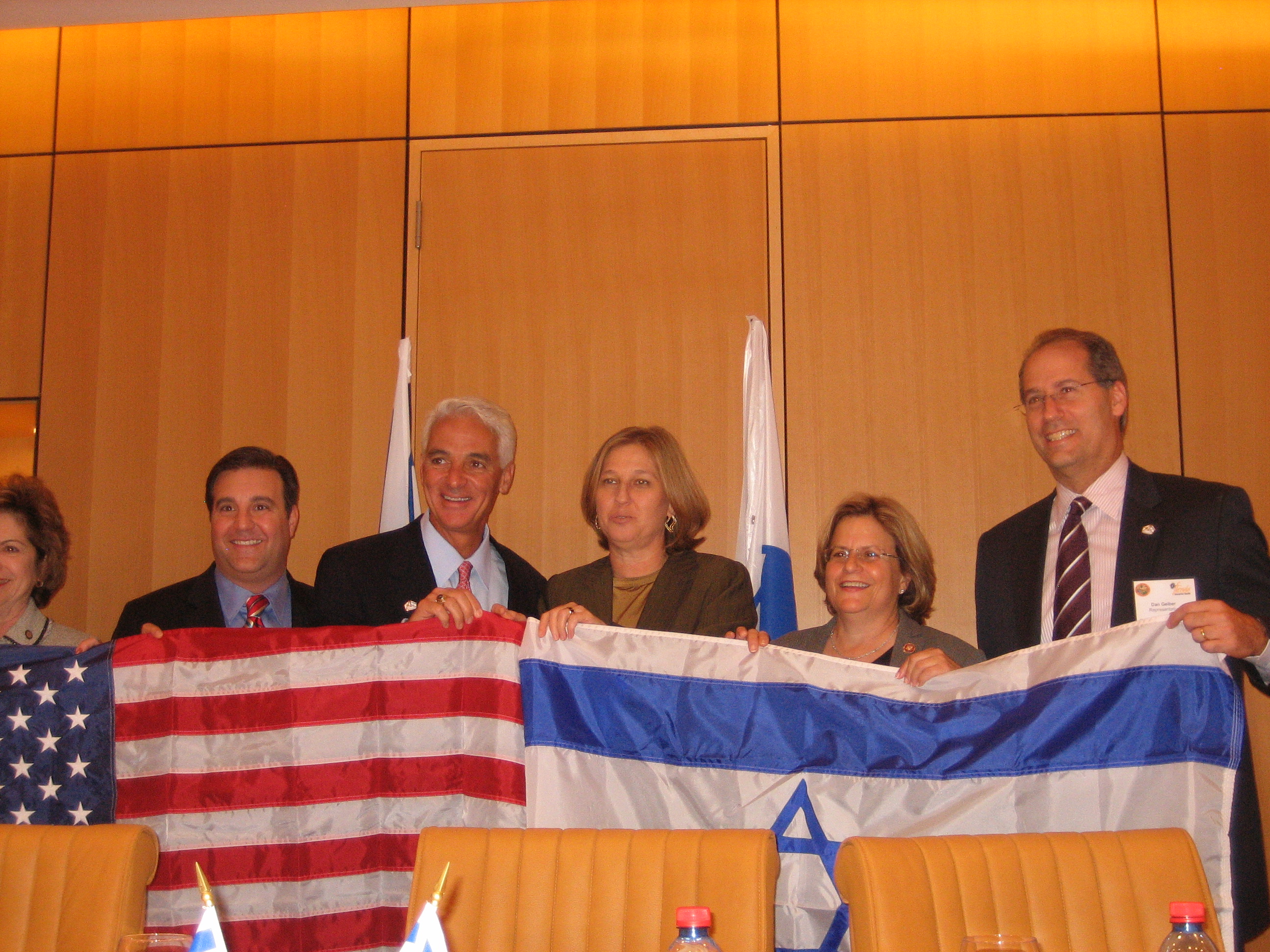 In a display of friendship, Ranking Member Ros-Lehtinen, Gov. Crist and Israeli Foreign Affairs Minister Tzipi Livni present the flags of the United States and Israel