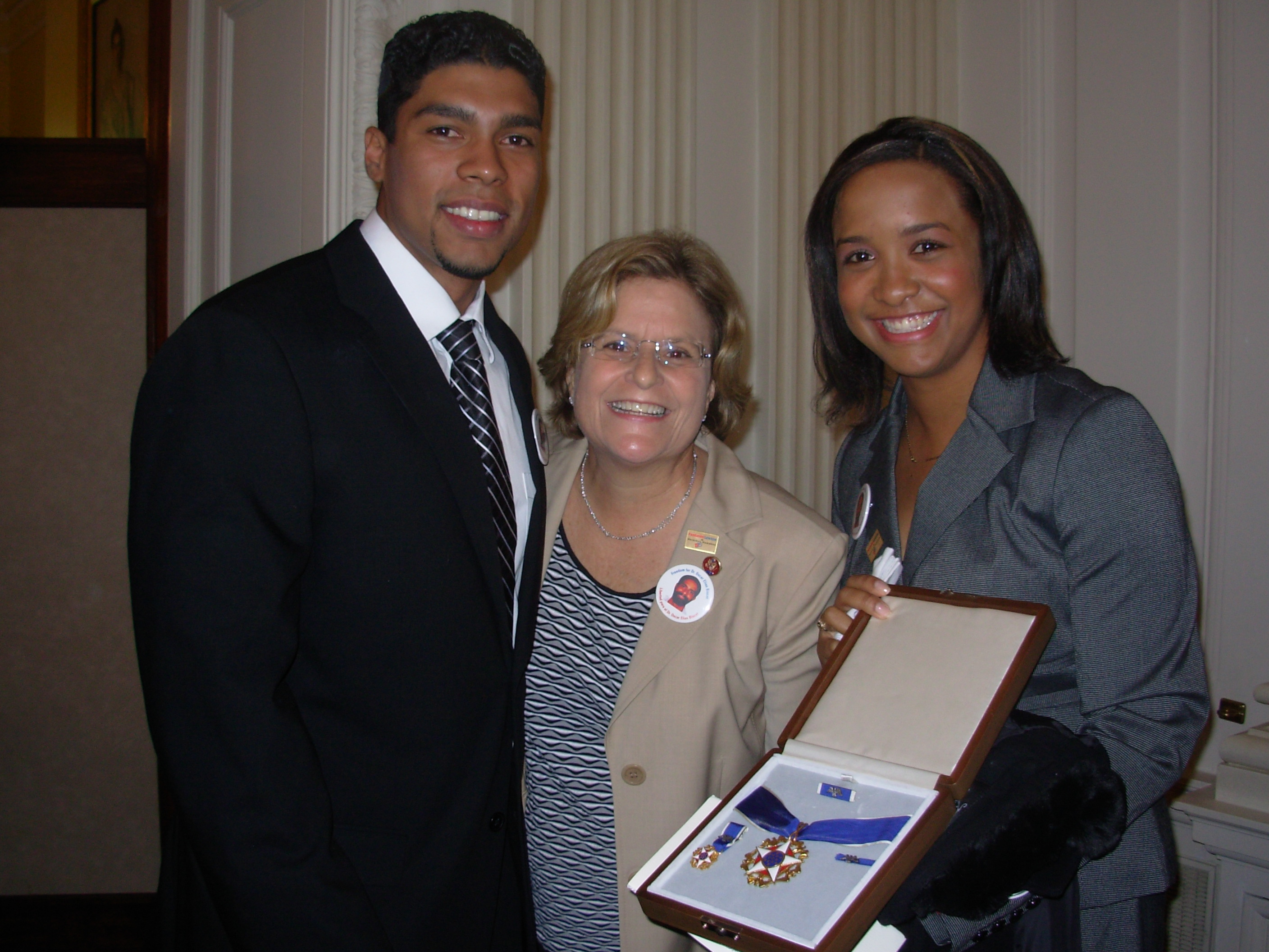 Ranking Member Ros-Lehtinen stands with Medal of Freedom recipient Oscar Elias Biscet's children (son) Yan Valdes and (daughter) Winnie following the White House Medal of Freedom Ceremony