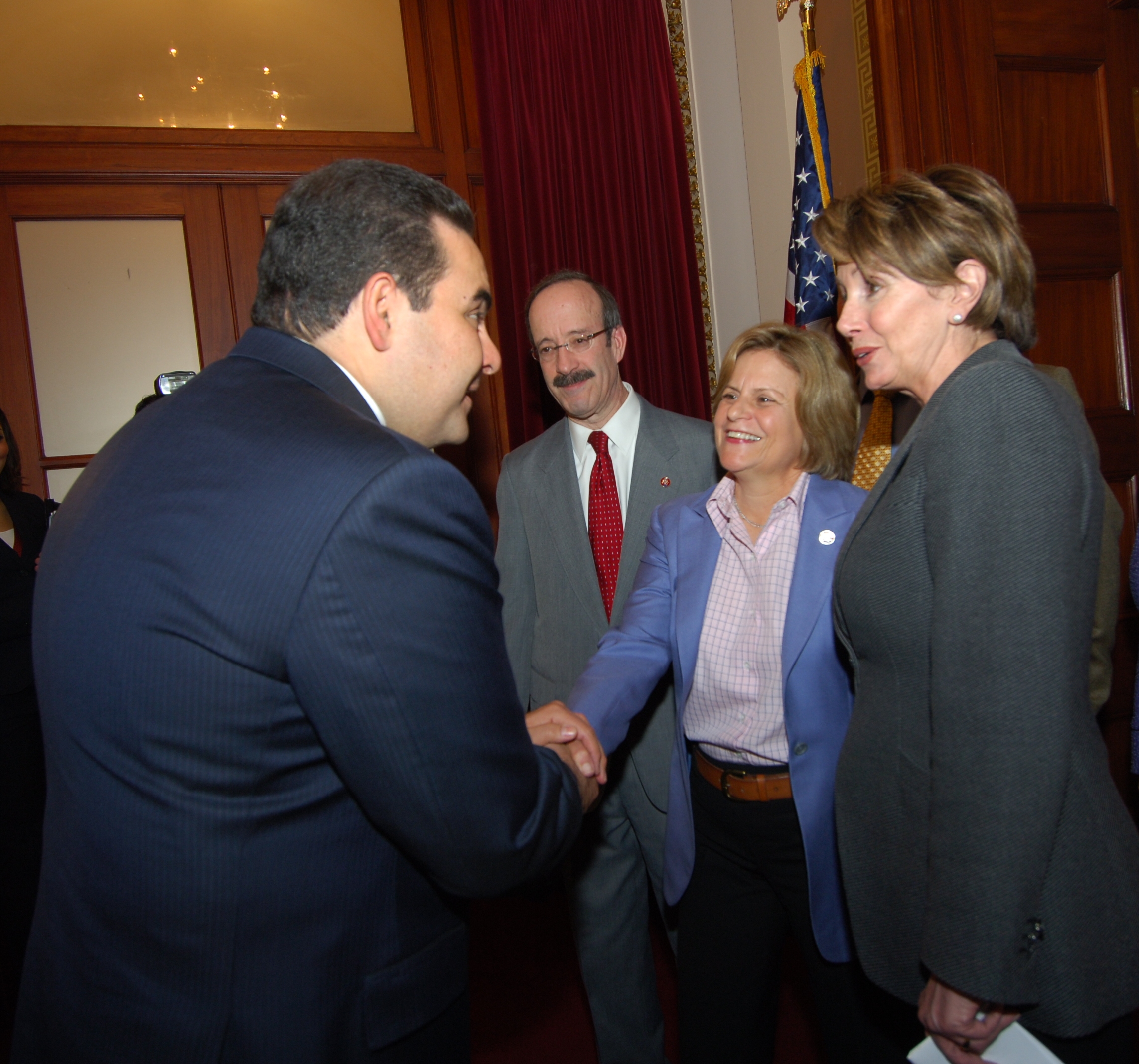 Ranking Member Ros-Lehtinen shakes hands with President Antonio Saca of El Salvador as House Speaker Nancy Pelosi and Representative Eliot Engel look on