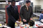 Representatives Meek and Ryan serve school lunches