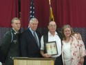 Hoyer Presents Ronald Drinks with his medals of honor