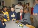 Hoyer Looks on as Student Design Their Own Lego Cars