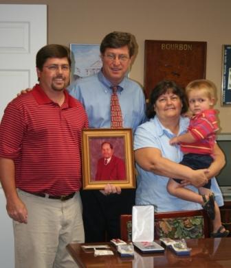 On August 17, 2007, Congressman Chandler presents military medals to the family of World War II veteran PVT James Mitchell Rison.  L to R: grandson, Wesley Carrington, Congressman Chandler, daughter, Phyllis Carrington, and great-grandson, Will Carrington.