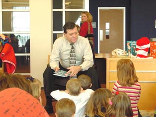 Rep. Cole reading to children