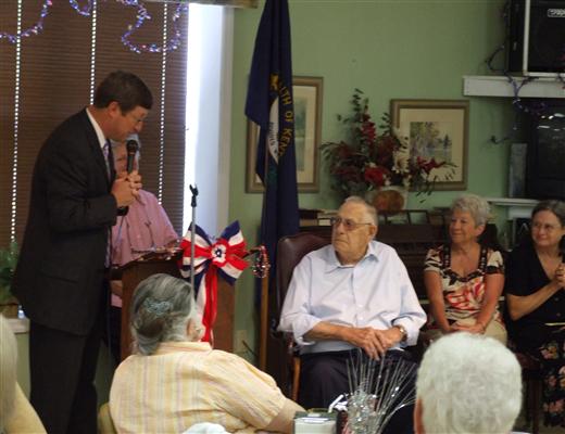Congressman Chandler congratulating WWII veteran PFC William Haydon at the Frankfort Senior Citizen's Center