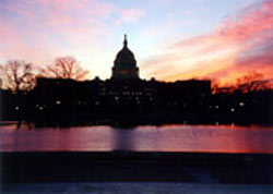 Another photograph of the Capitol. The section of D.C. between the Capitol and the Washington Monument is known as the mall. Here you can see the reflection of the Capitol and the dawn sky in a large man-made pool right at the beginning of the mall.