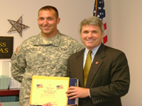 Congressman McCaul discusses the War on Terror and presents a flag flown over the Capitol to Private First Class Matthew Ray Franks, of Bellville, who is currently on leave from serving in Iraq.