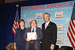 Congressman Abercrombie, with First Lady Laura Bush and U.S. Interior Secretary Dirk Kempthorne, accepts a $150,000 award on behalf of the City and County of Honolulu to develop a visitor infrastructure to showcase the historic nature of Honolulu's Chinatown through various exhibits, tours, and promotion of the area's businesses