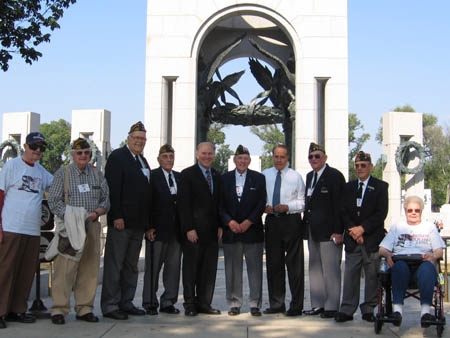 Pictured Above: Veterans from Green Township VFW Post 10380 pose in front of the National World War II Memorial in Washington, DC.  From Left to Right: Vasil Ognenoff (Green Township), Fred Kellerman (Green Township), Jack Snyder (Green Township), Congressman Steve Chabot, Ed Burke (Western Hills), Former Senator Bob Dole, Jim Copenhaver (Green Township), John "Buzz" Haberthier (Lawrenceburg, Indiana), Betty Holtkamp (Miami Heights).