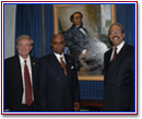 Congressman Robert Ney, Chair of the House Fine Arts Board, Portrait Artist - Simmie Knox and Congressman Chaka Fattah pose with the portrait of America's first African American Congressman, Joseph H. Rainey.