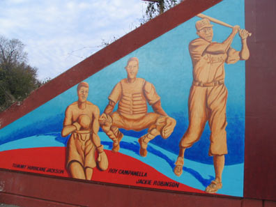 The mural depicts baseball stars such as Jackie Robinson who made their home in St. Albans. 