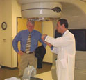 This is an image of Dr. Scott Schneider explains to Congressman Baird how physicians at Northwest Cancer Care provide radiology treatment to cancer patients.
