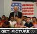 Congressman Hall and children at Fowler Elementary display their mural