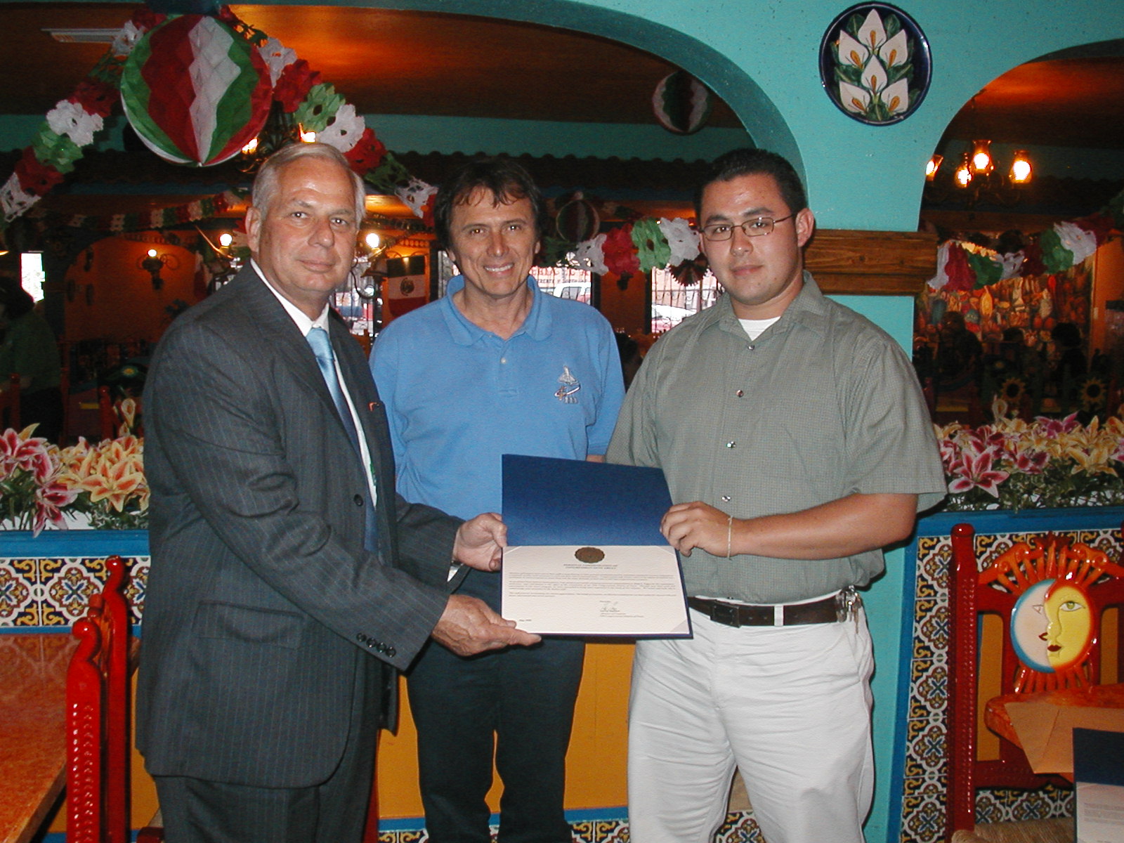 Jerry Lopez, District office intern receives Certificate of Appreciation from Rep. Green