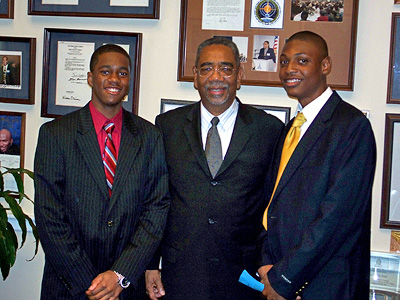 Rep. Rush (center) welcomes Urban Prep Charter Academy for Young Men students Walter Hall (left) and Cameron Barnes (right) during their visit to Capitol Hill July 11
